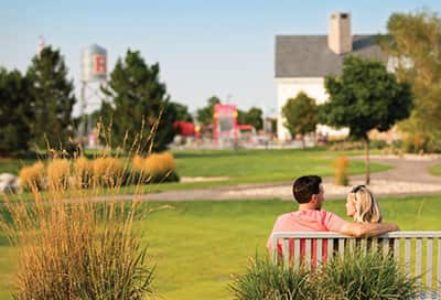 Couple on a bench with Reunion metropolitan district in the background.